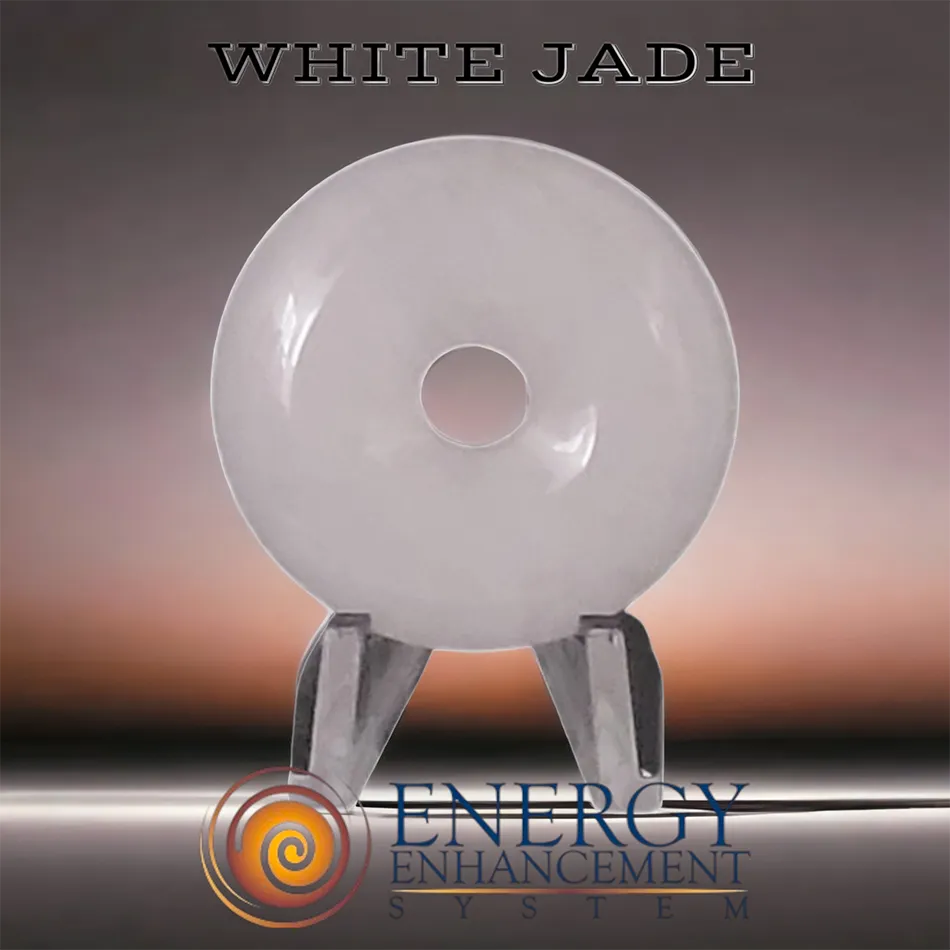 a white jade medallion on a stand